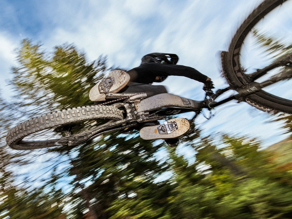 A guy riding a mountain bike.